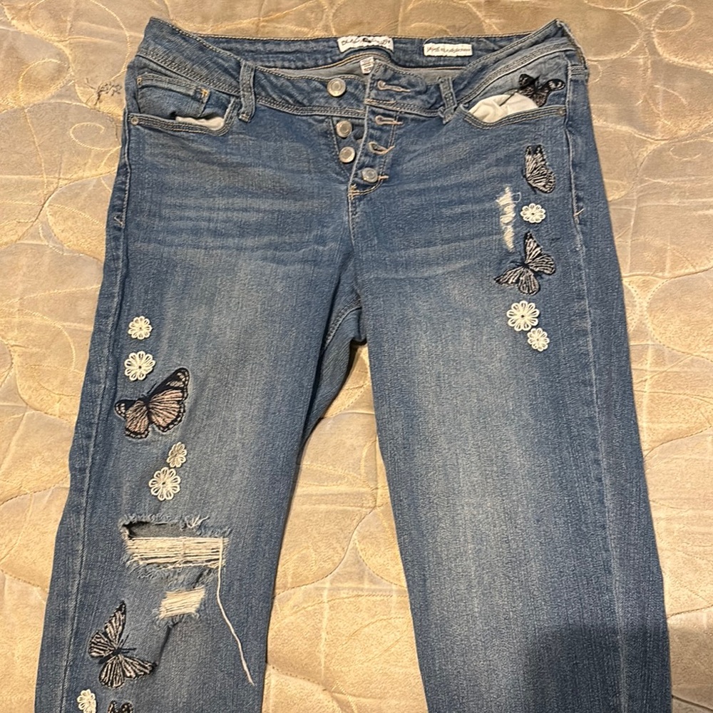 Blue Skinny Cropped Jeans with Distressed Details and Butterfly Patches